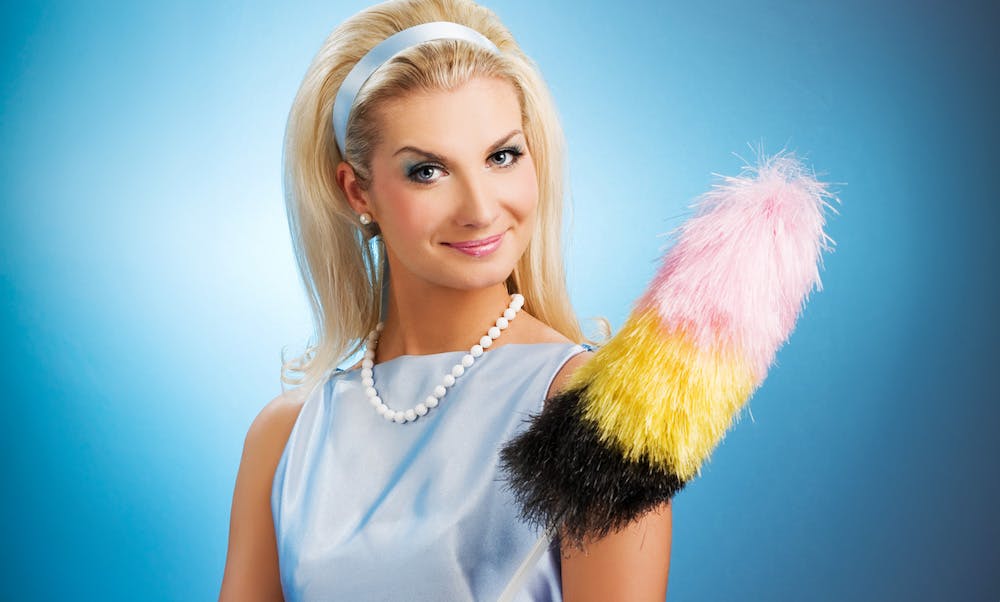 Woman holding feather duster