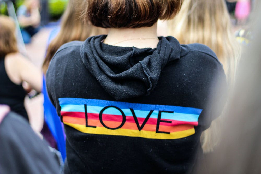 Teen wearing LOVE hoodie